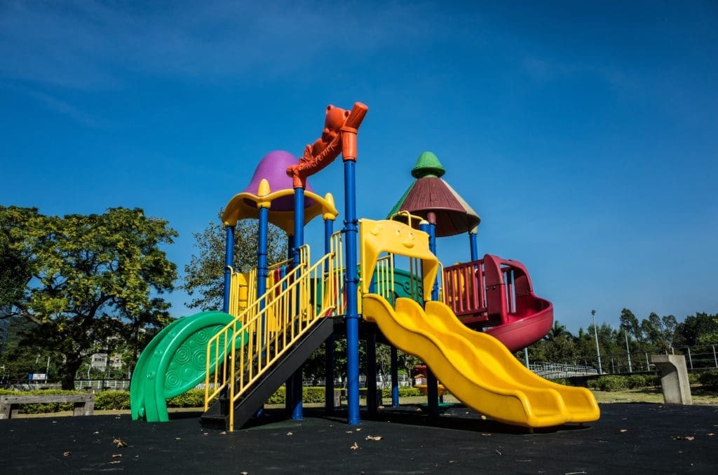 multicolored playground slide during daytime
