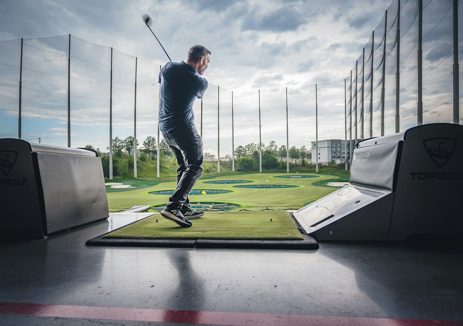 Photo by Matt Benson a man playing golf