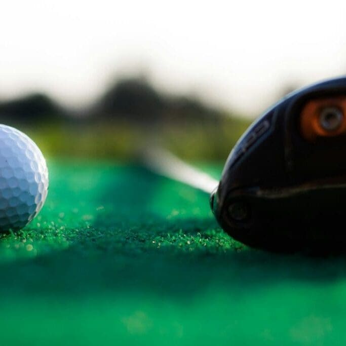 shallow focus photography of white golf ball