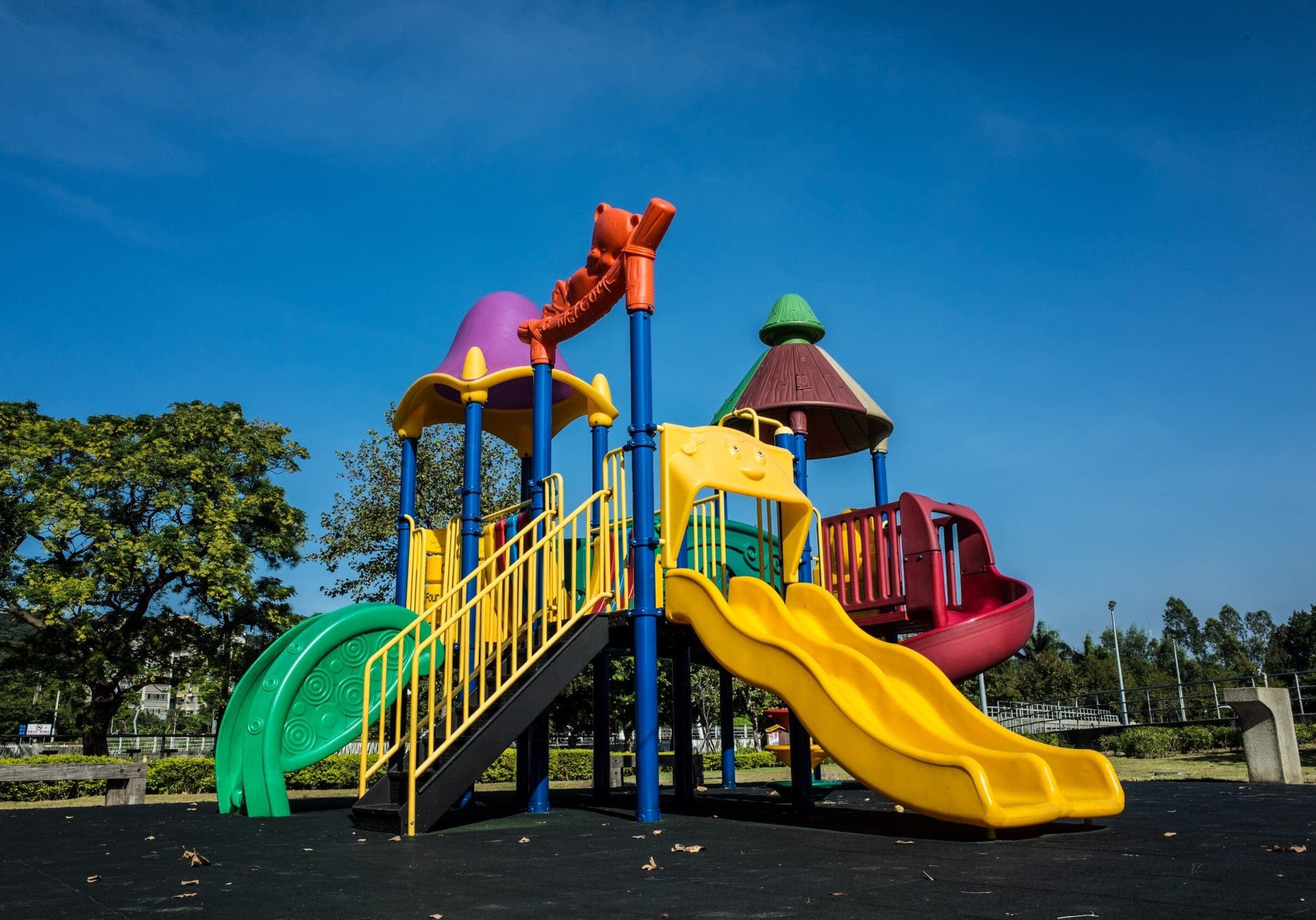 multicolored playground slide during daytime